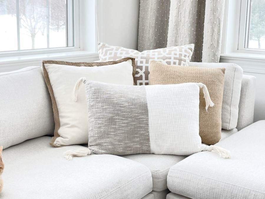 7 gray and white throw pillows cushions with white couch