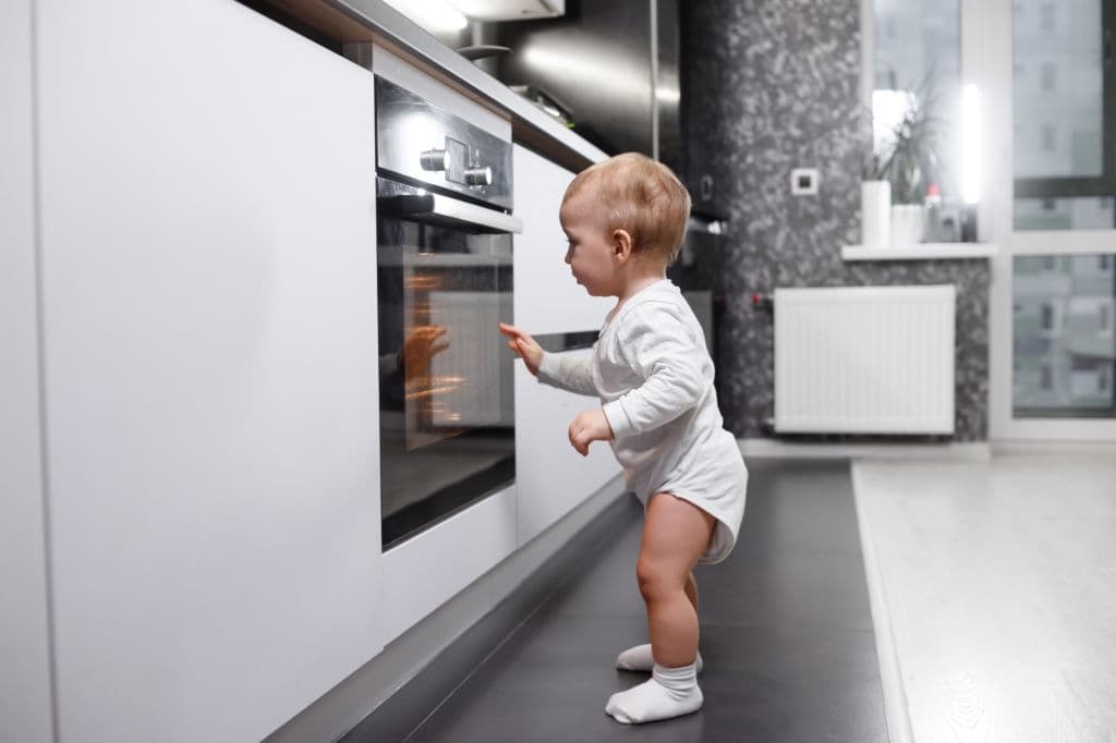 baby boy near oven