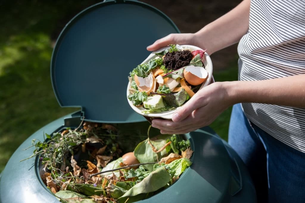 food waste into garden composter