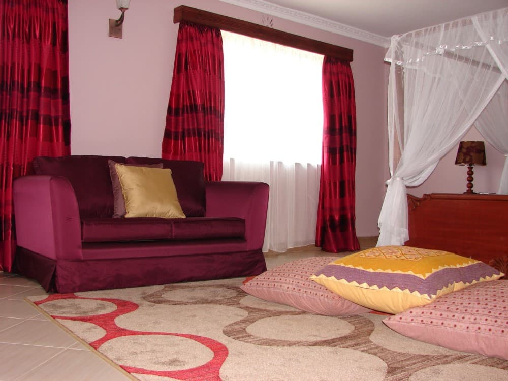 11 red curtains with purple walls