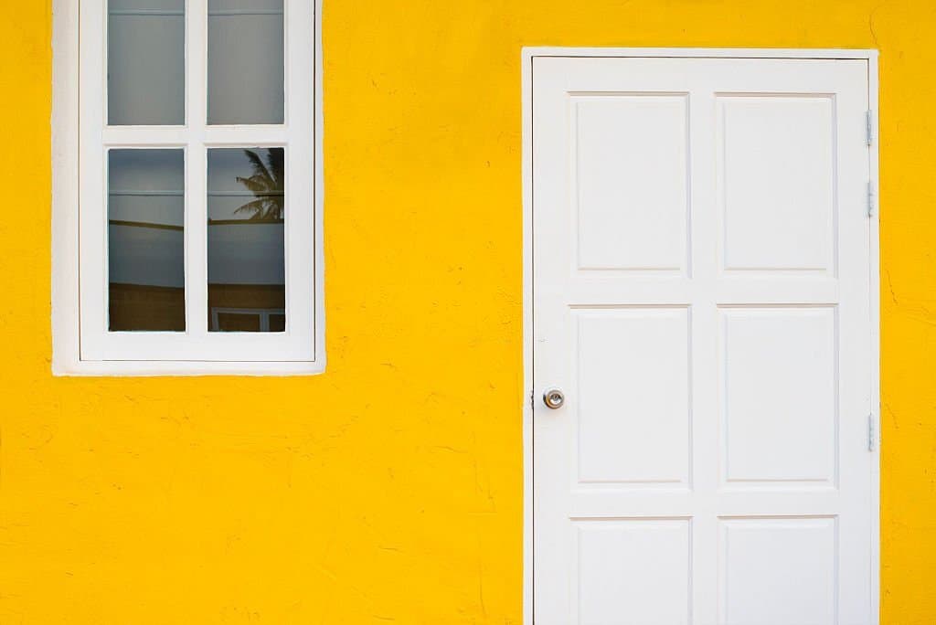 14 white front door with yellow houses 1