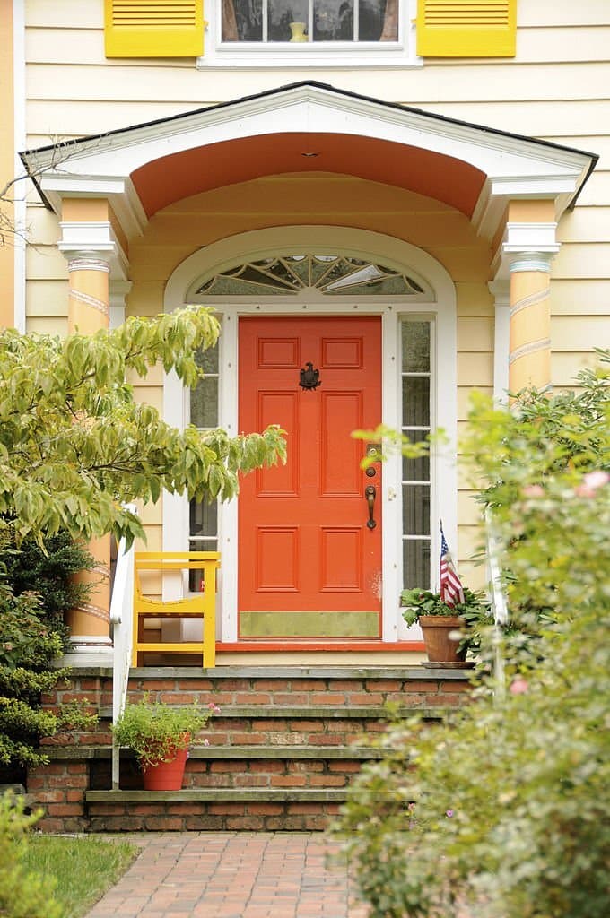 8 orange front door with yellow houses