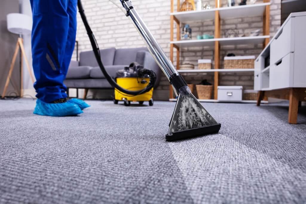 cleaning carpet with vacuum cleaner