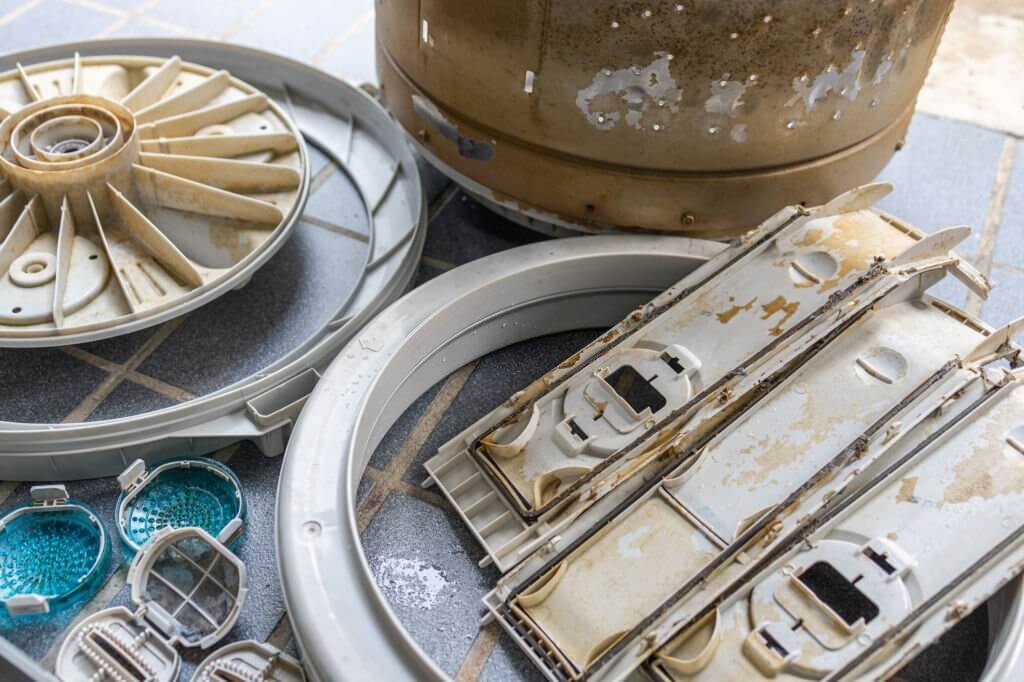 parts of the washing machine are filled with mold