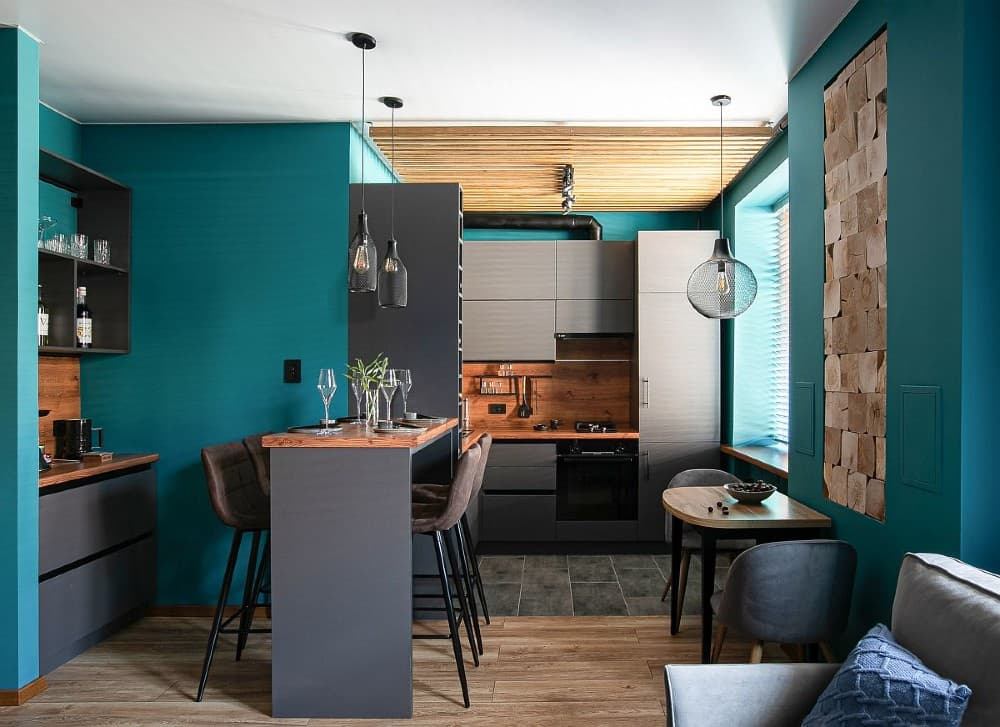 Turquoise walls with gray kitchen cabinets