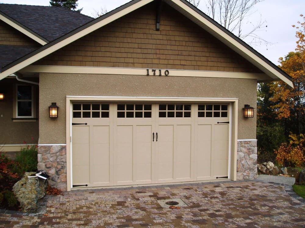 beige garage door with brown house