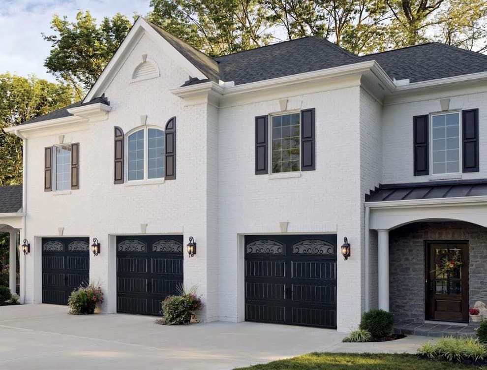 black garage door color with white house