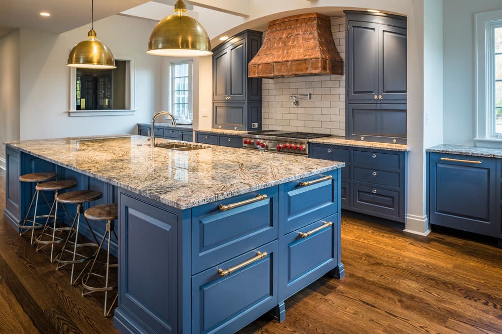 blue cabinets with brown granite countertops