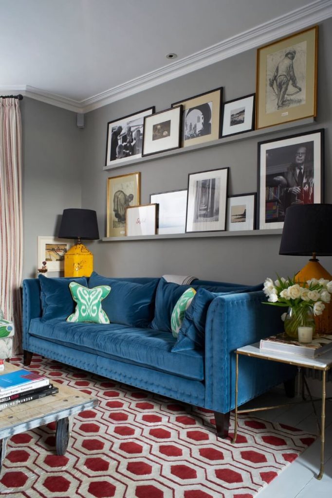 blue couch with gray walls