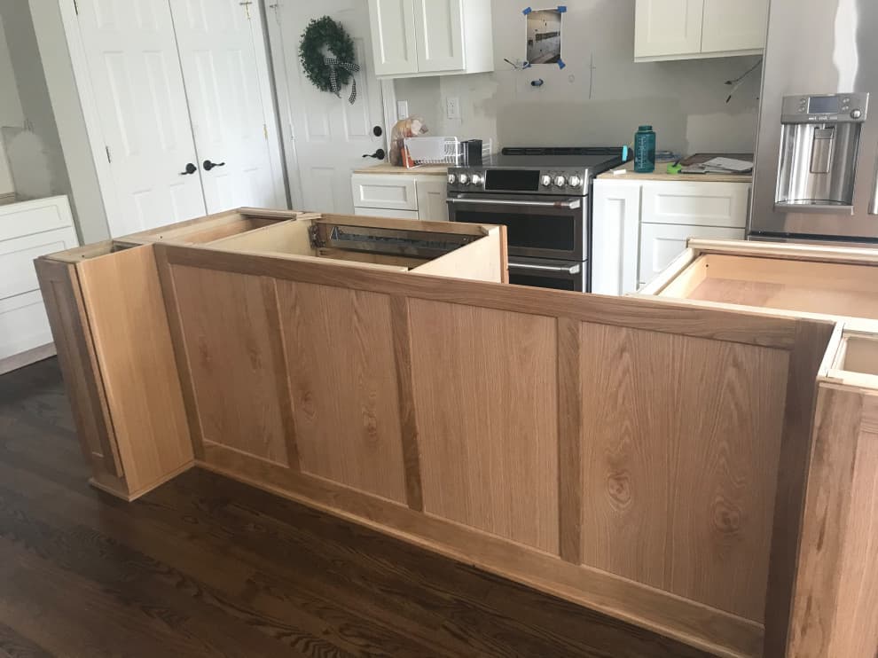 brown flooring with oak cabinets