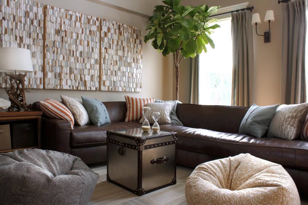 brown leather couch with gray walls