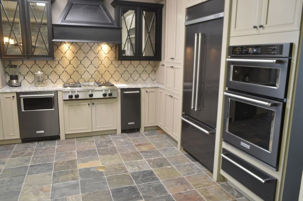 cream cabinets with black stainless steel appliances