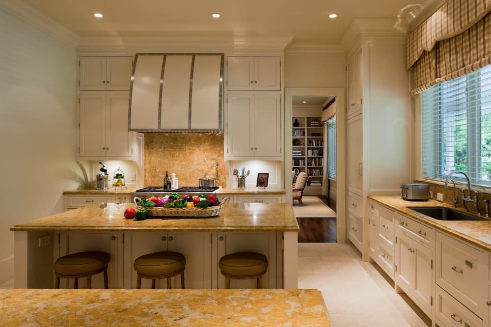 golden granite with cream cabinets