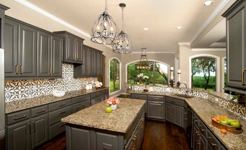 gray cabinets with brown granite countertops