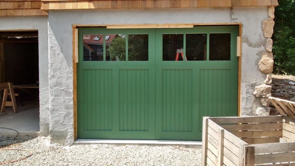 green garage door color with white house