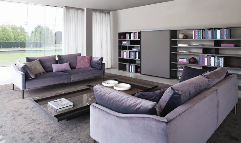 lavender couch with gray walls