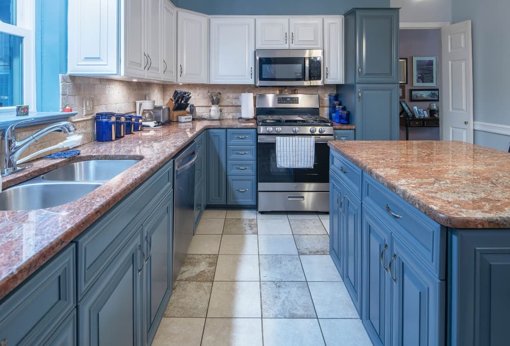 light blue cabinets with brown granite countertops