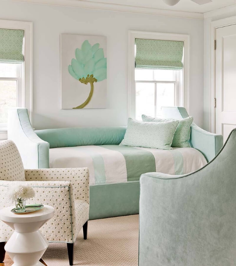 mint green couch with gray walls