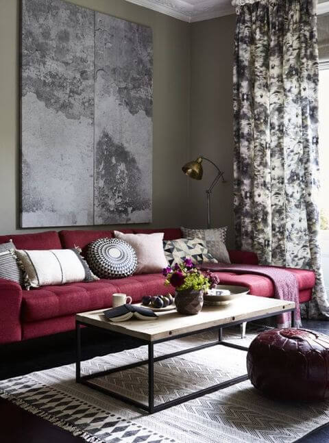 mulberry couch with gray walls