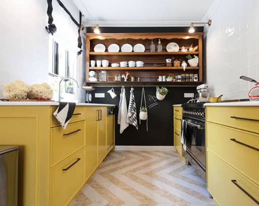 mustard yellow cabinets with black stainless steel appliances