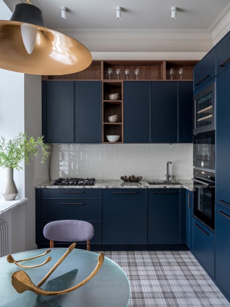 navy blue cabinets with black stainless steel appliances