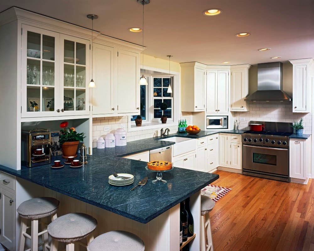 navy blue countertop with white cabinets