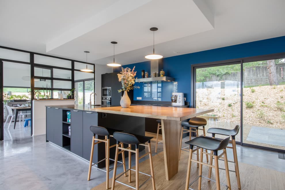 navy blue walls with gray kitchen cabinets