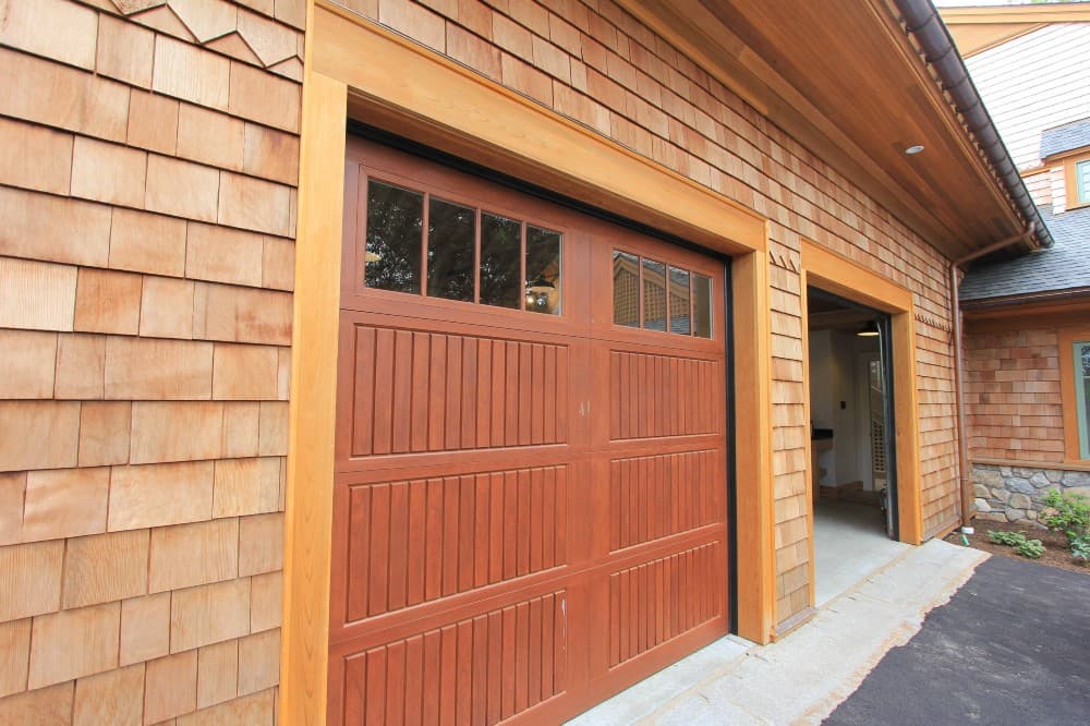 orange garage door with beige house