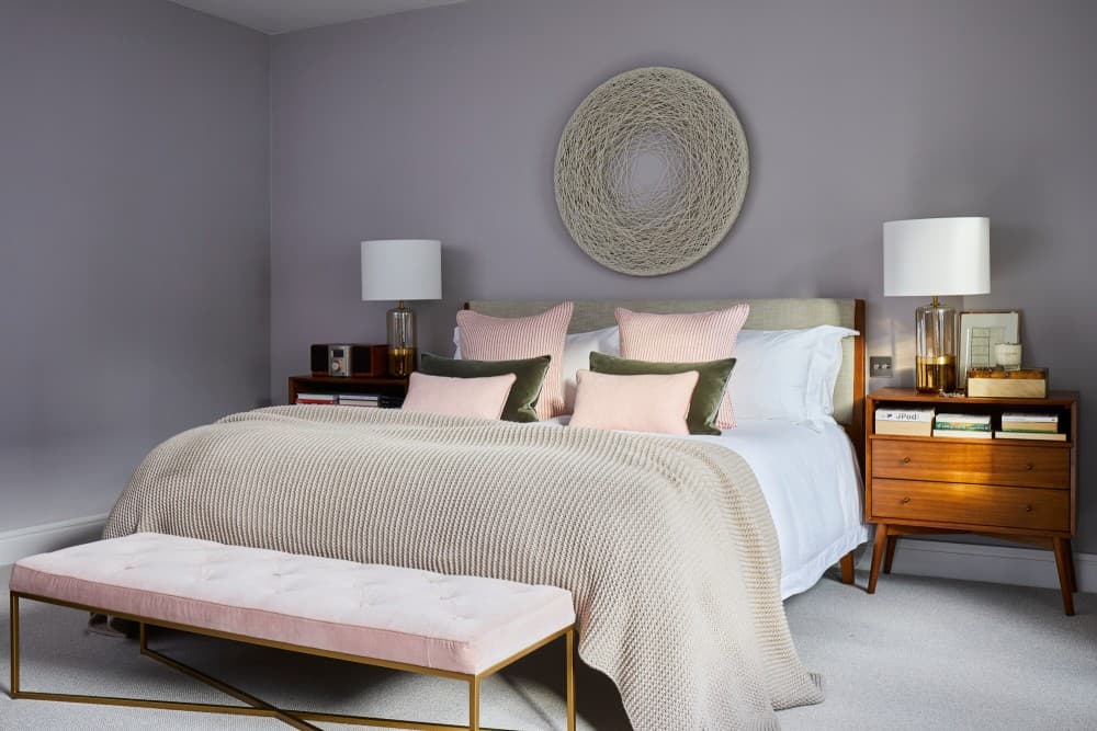 pale pink bedding with gray wall