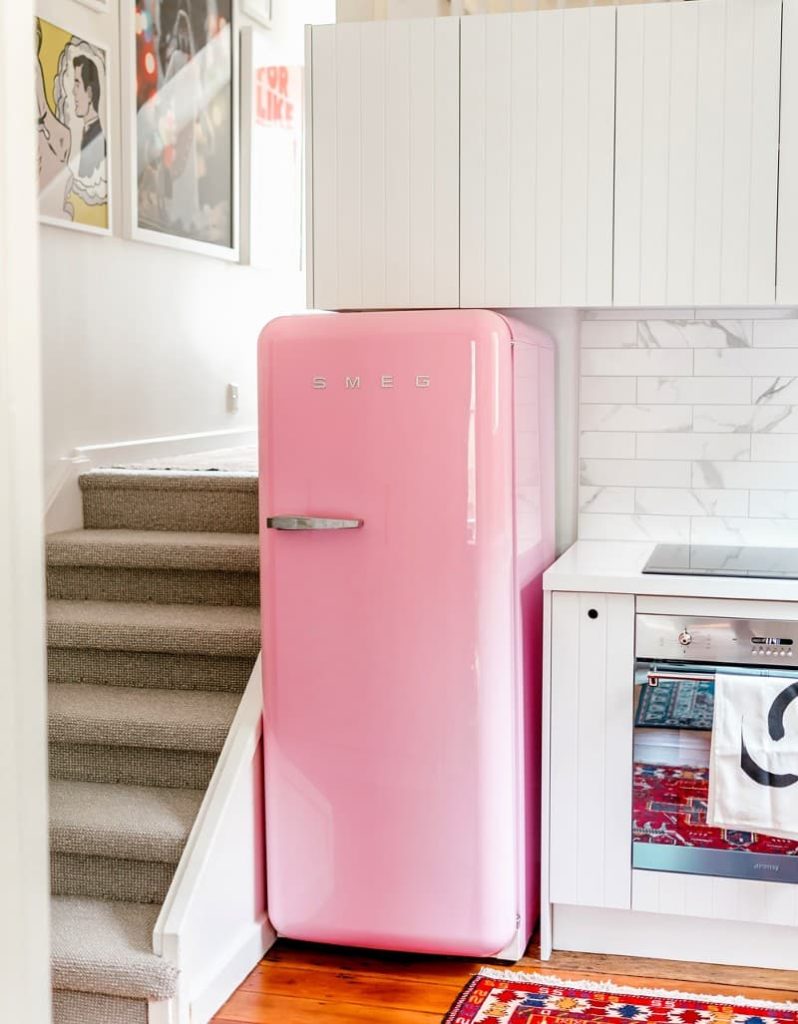 pink appliances with white cabinets