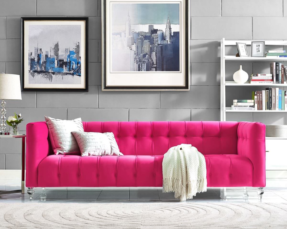 pink couch with gray walls
