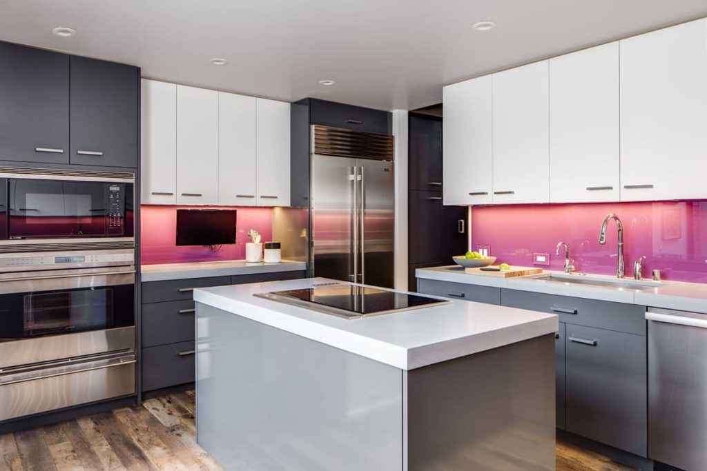pink walls with gray kitchen cabinets