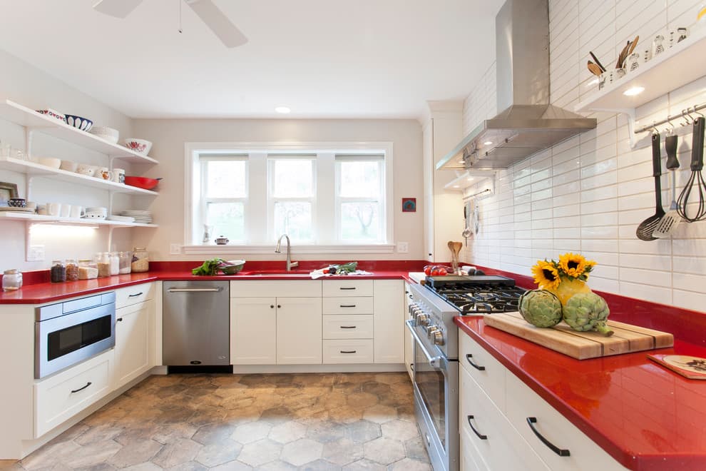 red countertop with white cabinets