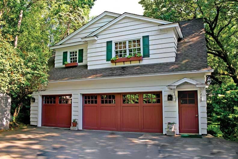 red garage door color with white house