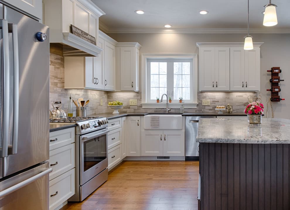 silver appliances with white cabinets