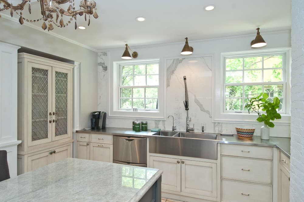 stainless steel countertop with white cabinets