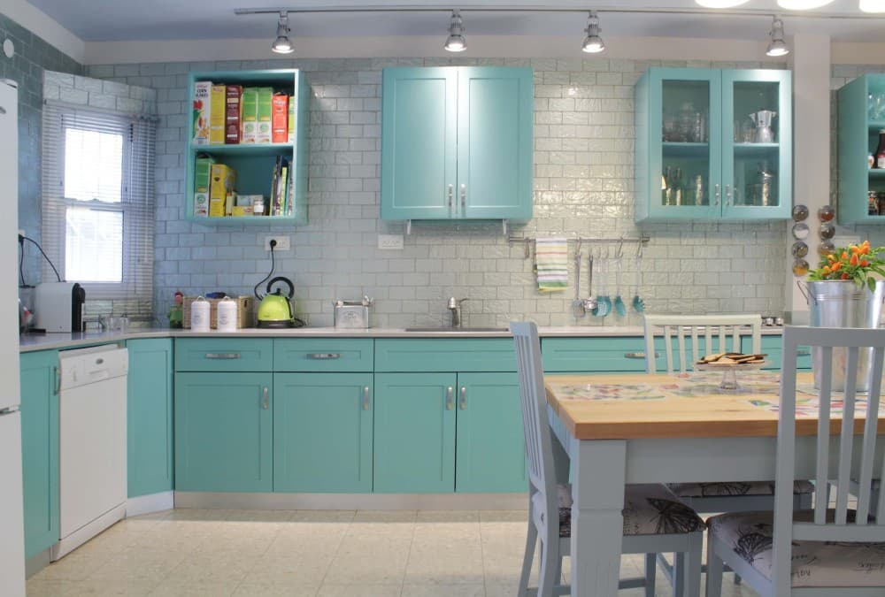 teal cabinets with gray walls
