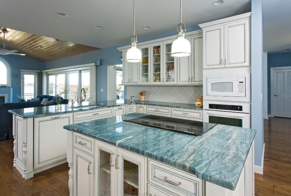 teal countertop with white cabinets