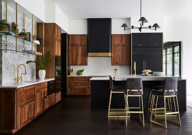 walnut cabinets with black stainless steel appliances