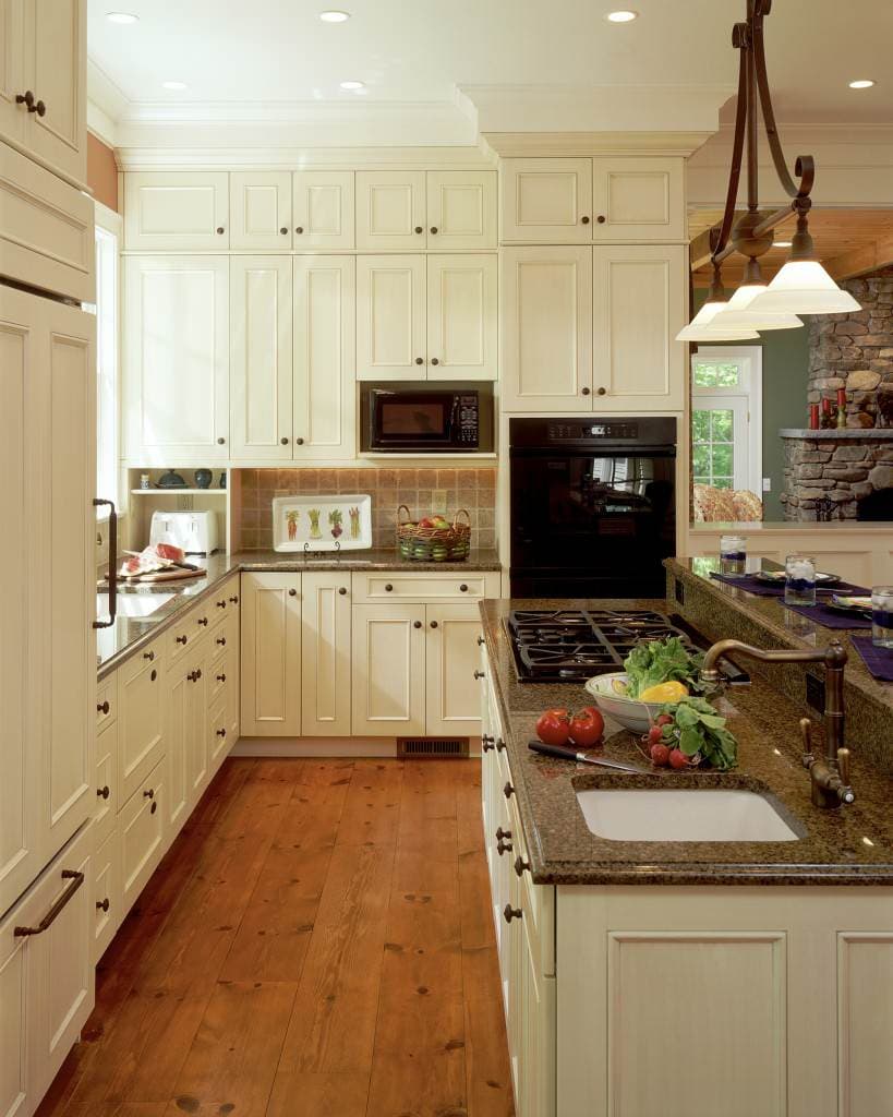 white cabinets with brown granite countertops