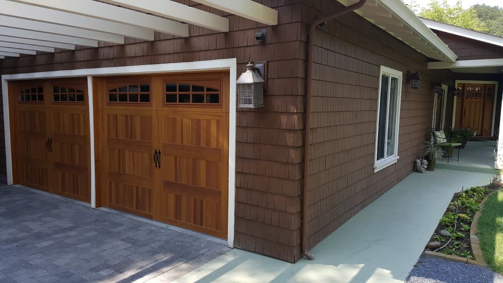 wood garage door with brown house