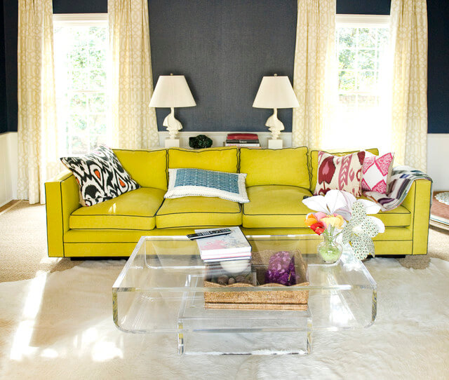 yello couch with gray walls