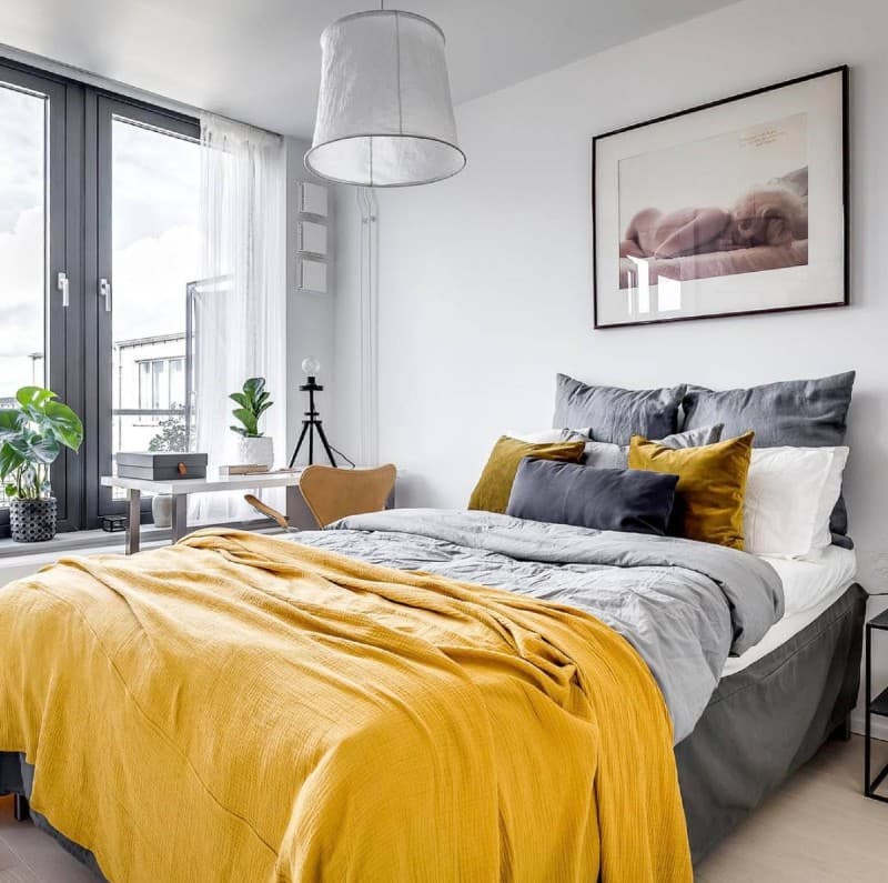 yellow bedding with gray wall