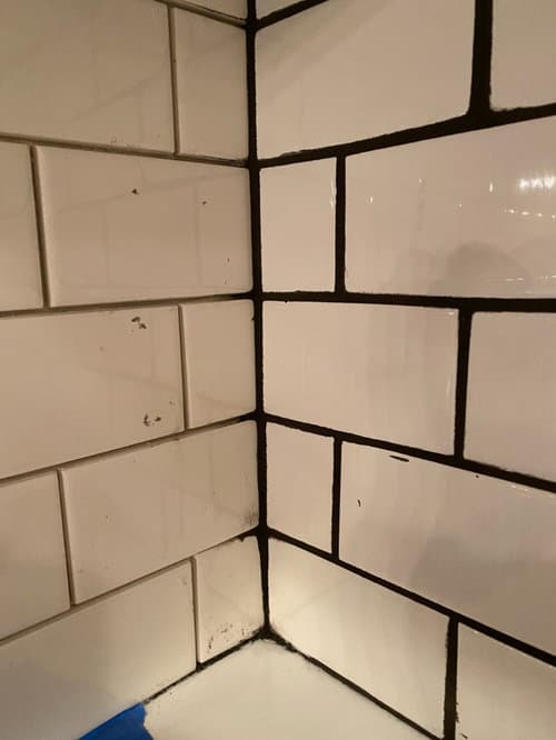 black grout with beige tile