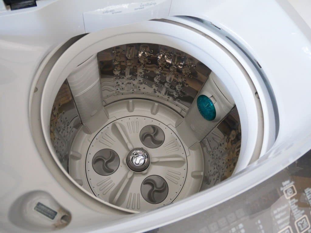 how to drain water from top loading washing machine