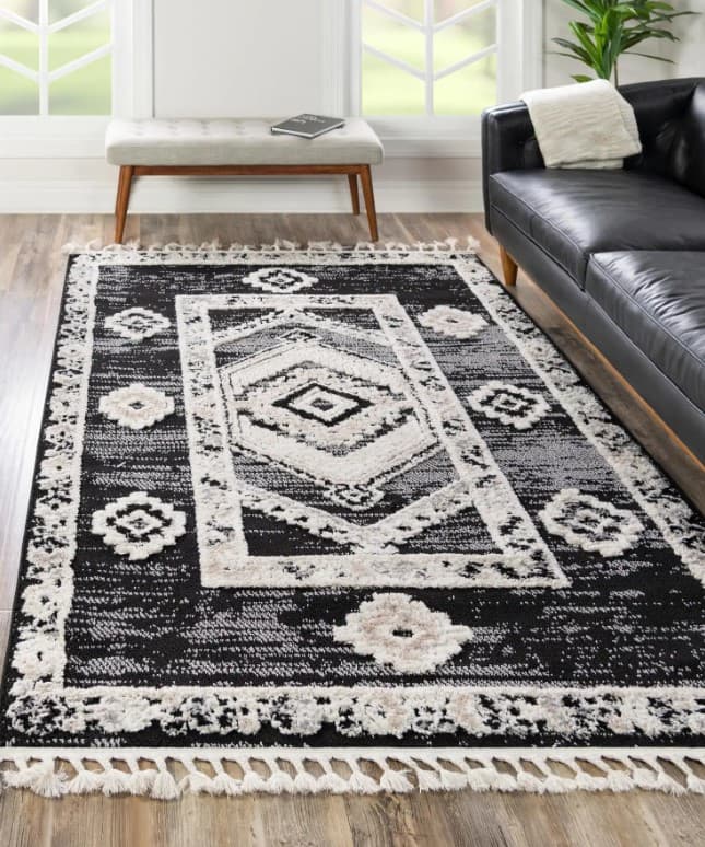 black and gray rug with black furniture