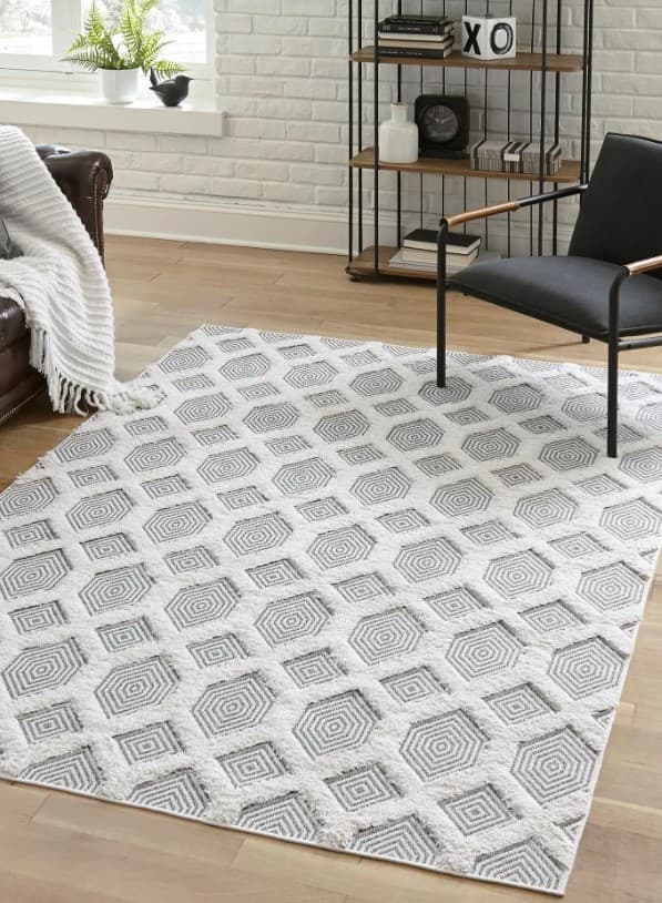 gray rug with black furniture