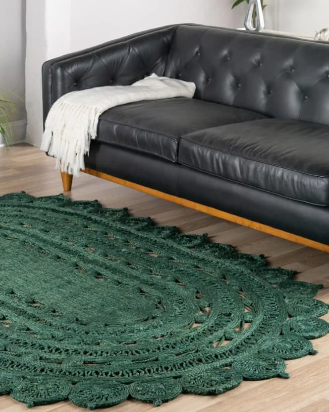 green rug with black furniture