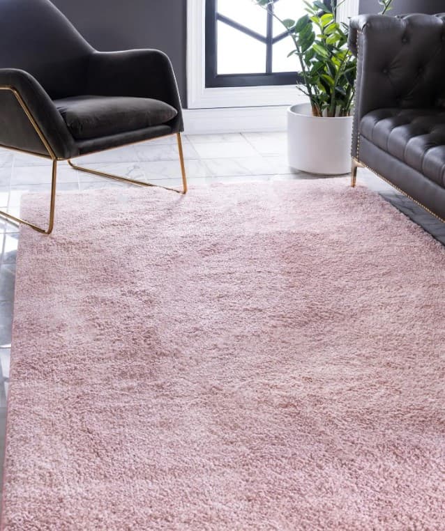 pink rug with black furniture