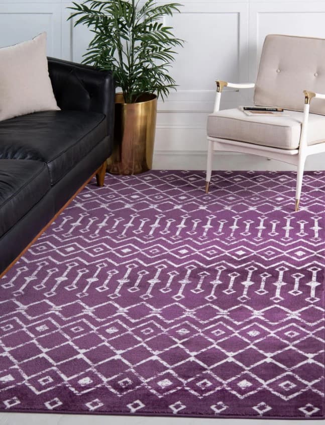 purple rug with black furniture